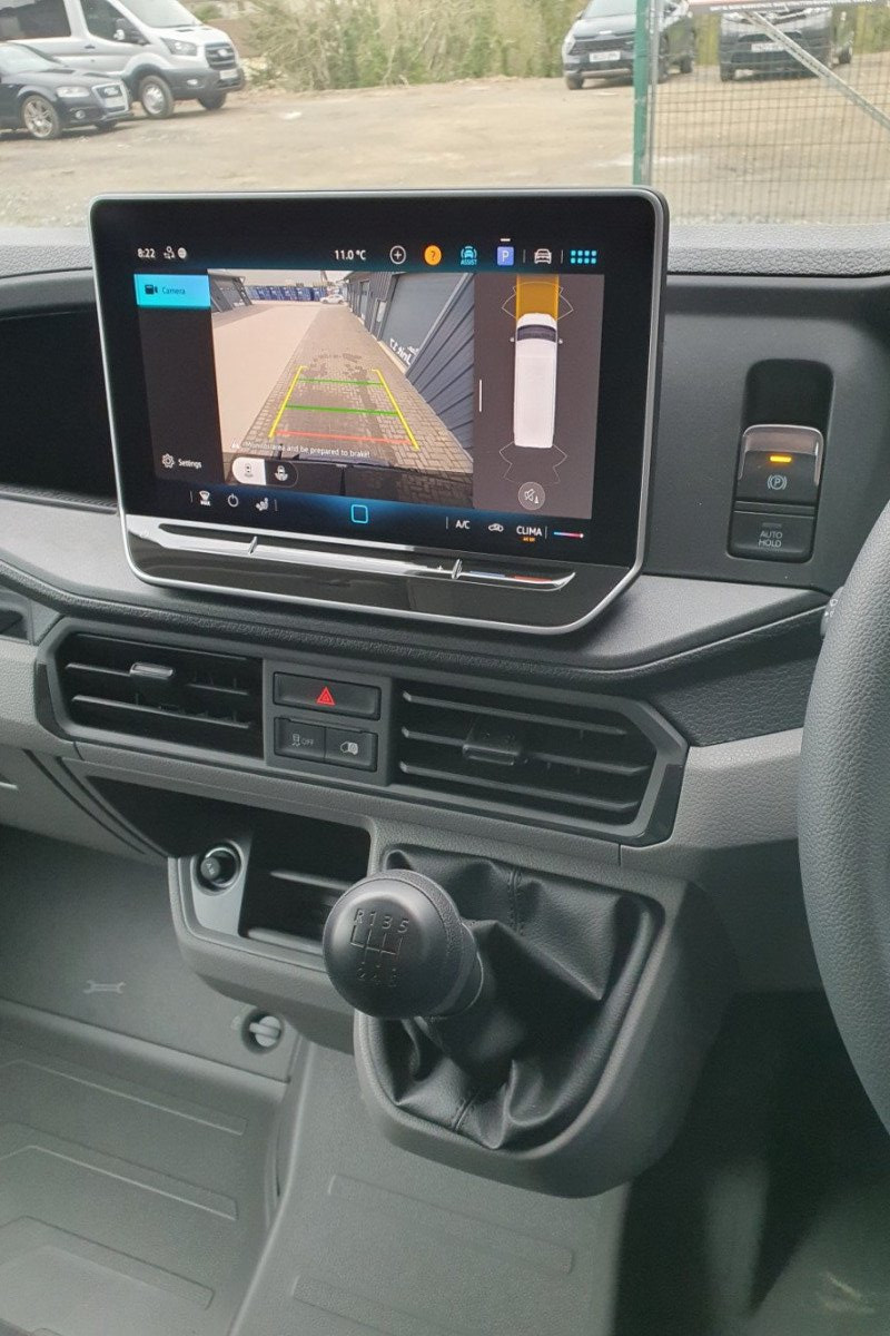 Drivers seat and interior console of LWB Van for hire in Bude, North Cornwall