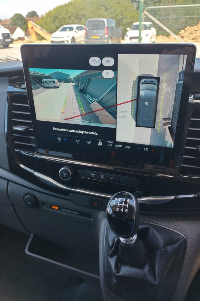 Reverse camera screen at front of 17 Seater minibus