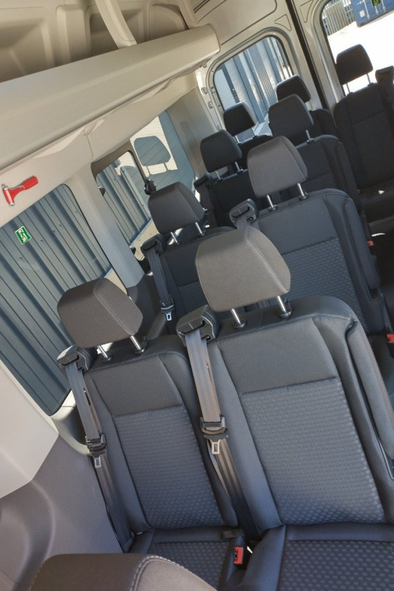 Interior view looking towards the back of 17 Seater minibus